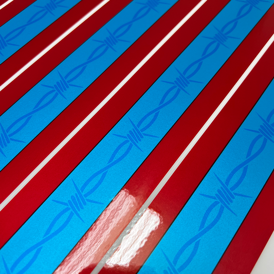 Close-up of red and blue striped pattern with barbed wire design.