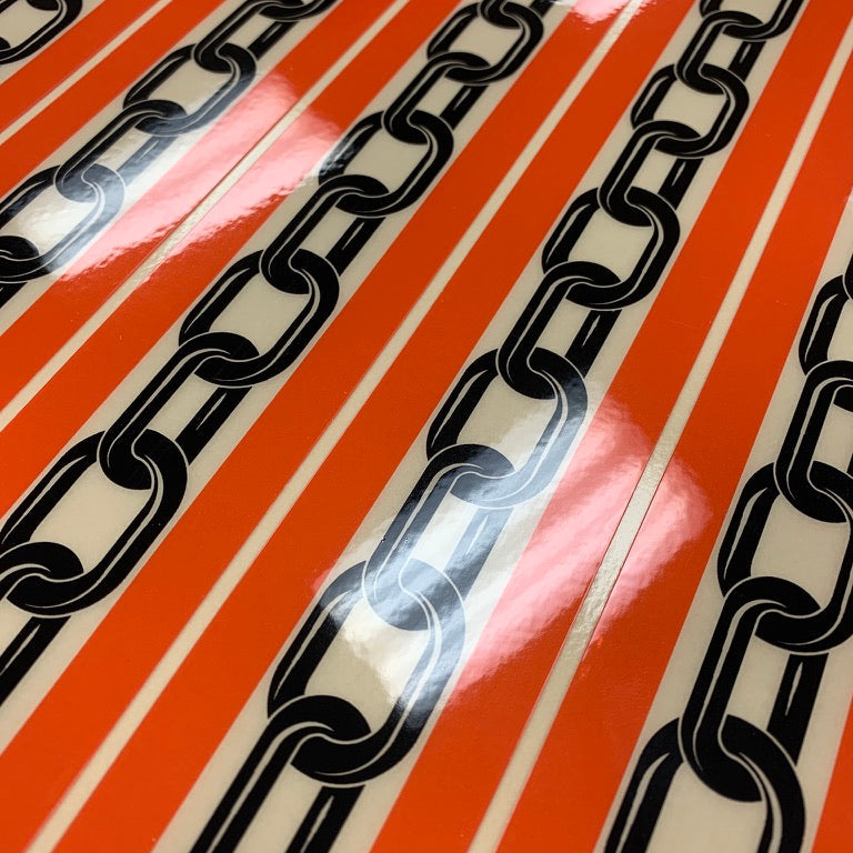 Black chain design on red and white striped background