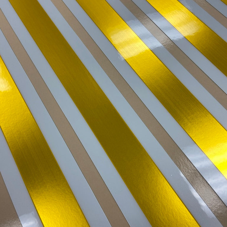 Striped pattern with yellow and white horizontal lines on a textured surface