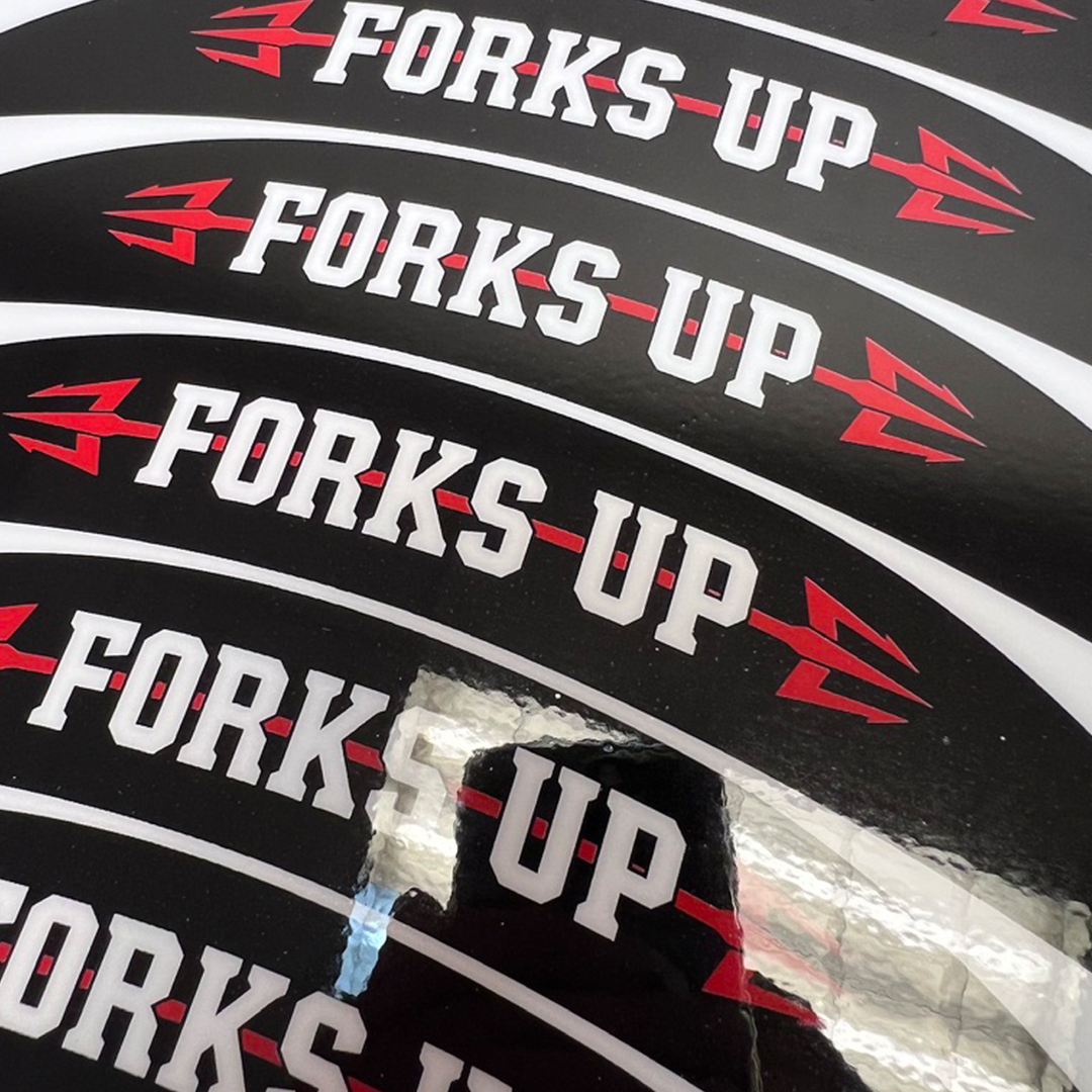 Multiple 'Forks Up' branded bicycle fork covers with a visible brand logo.