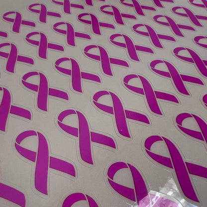 Purple ribbon stickers on a white background